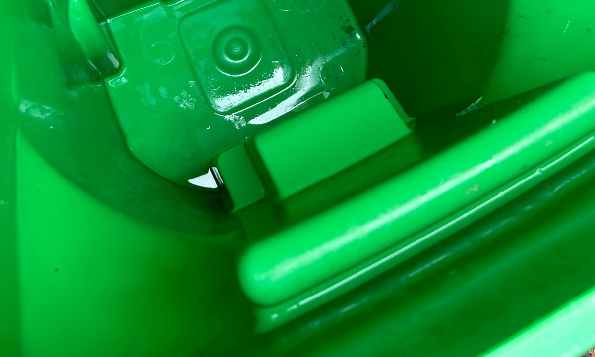 The same trash bin after cleaning by Bin Odor Blasters, rinsed clean and odor free