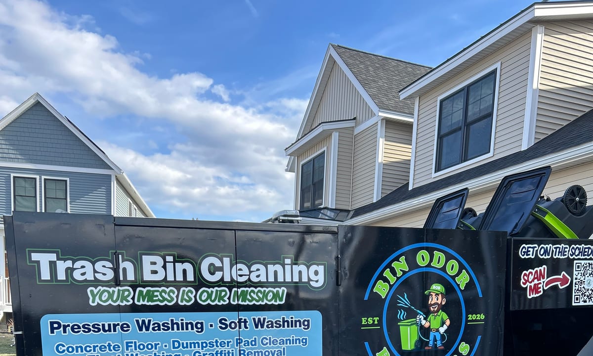 Bin Odor Blasters branded trash bin cleaning trailer parked at a Vermont job site