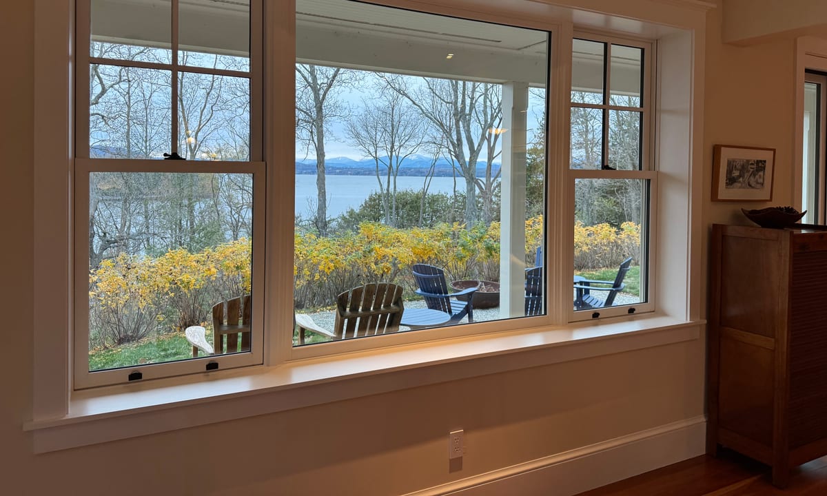 Interior bay windows cleaned by Stone Window Cleaning, looking out over Lake Champlain in Vermont